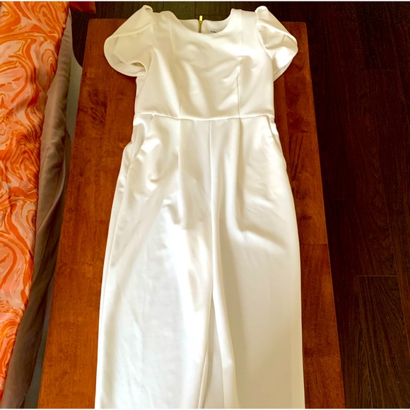 Calvin Klein Pants - White Calvin Klein jumpsuit with pockets and gold zipper cuff sleeves size 4